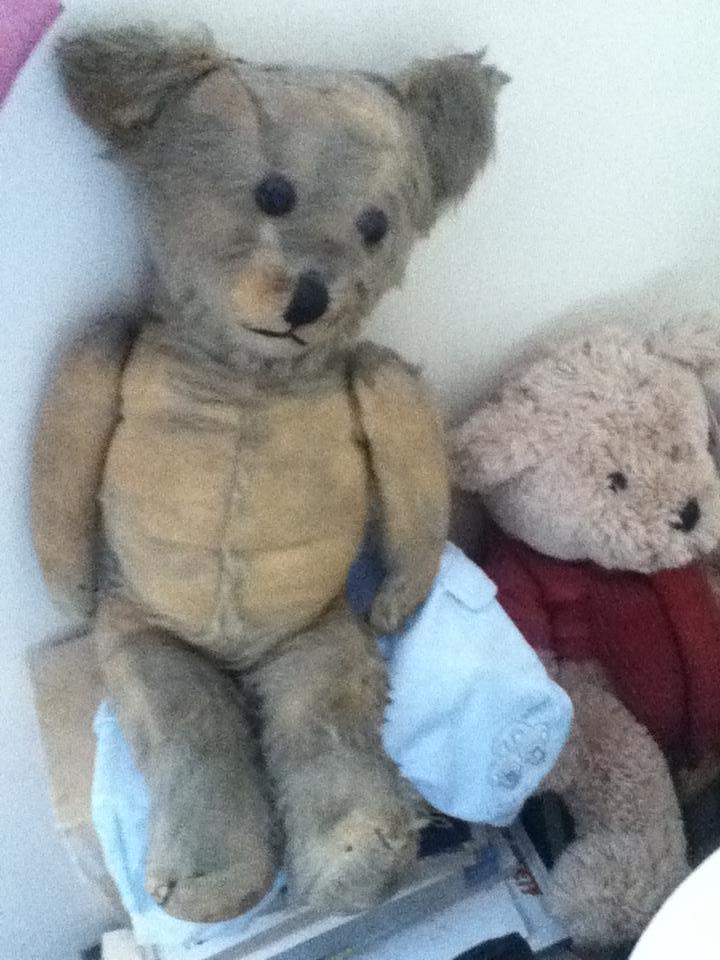 I spend a few moments before the funeral with Mams old teddy circa 1950.  Very worn from a lifetime of cuddles and greatly loved.  You can just see the stitching on top of his head when he was burnt by a piece of coal that spat out of the fire.  He was repaired by my Grandad about 60 years ago.
