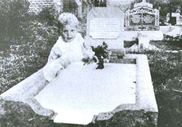Child by grave