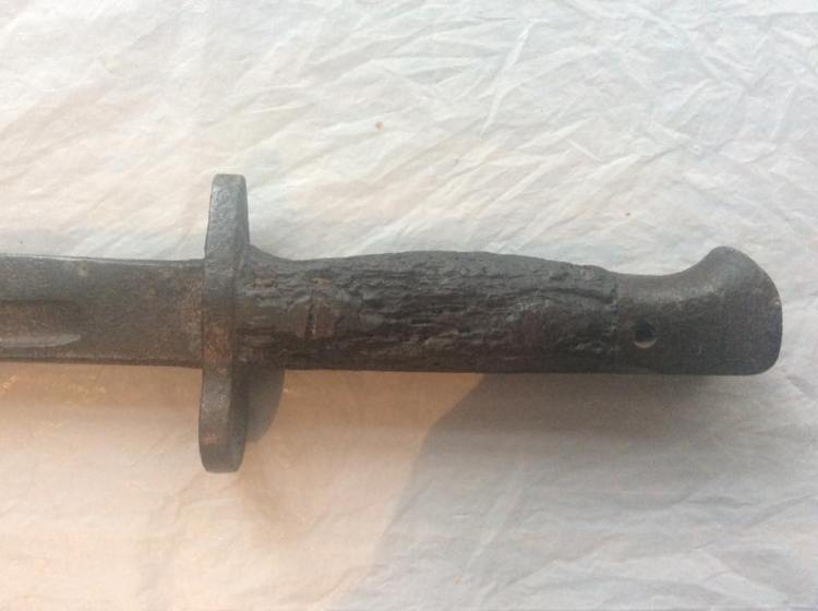 You can see where the bayonet handle has slightly decomposed due to a century in the mud.