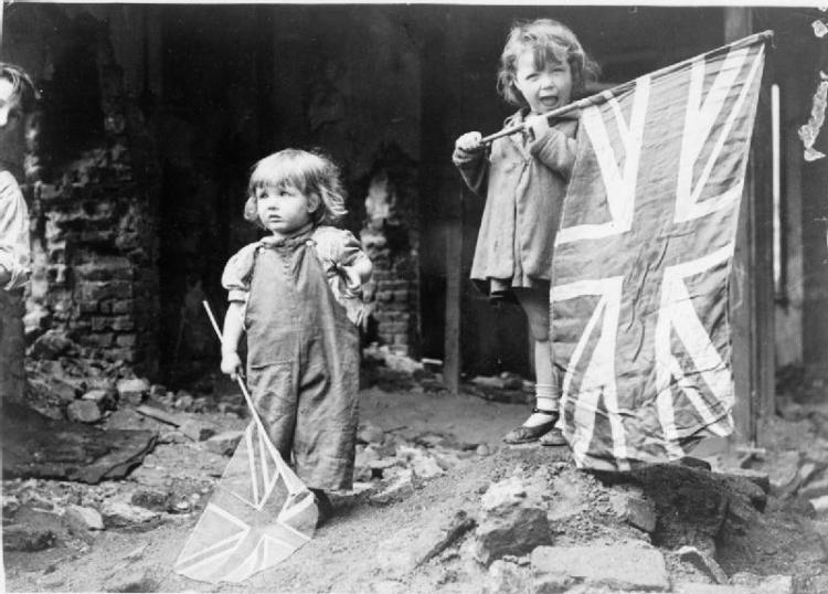 Two little girls in the bombed out area of Battersea, London