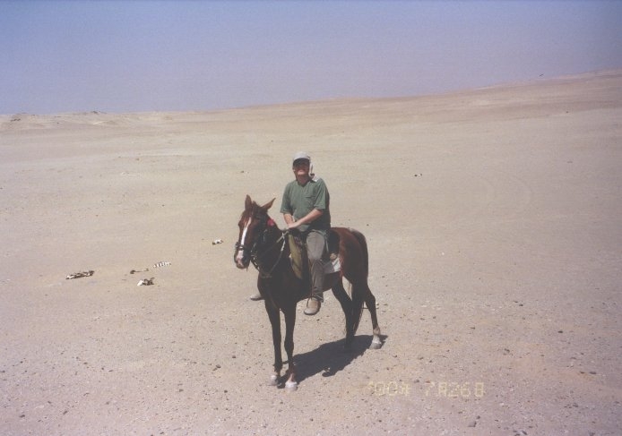 Me - Stephen Liddell - in the Sahara... ok it's not a camel but it is day-time. Somewhere on the edge of the Qattara Depression in the sands of the Libyan Desert.