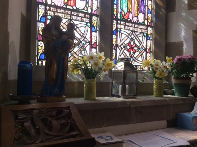The church is beautifully decorated with a variety of spring time flowers on all the windows and pillars.