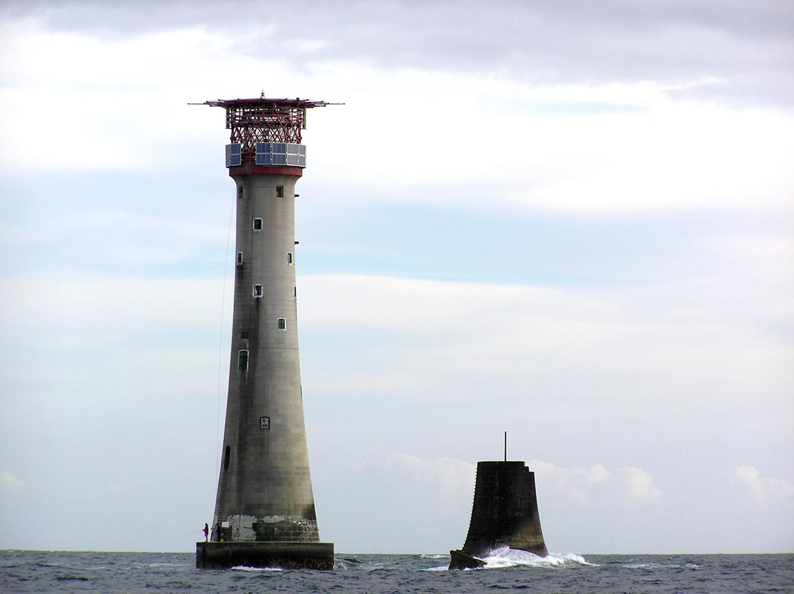 The current Victorian era Eddystone Rocks Lighthouse next to the remains of an earlier one.