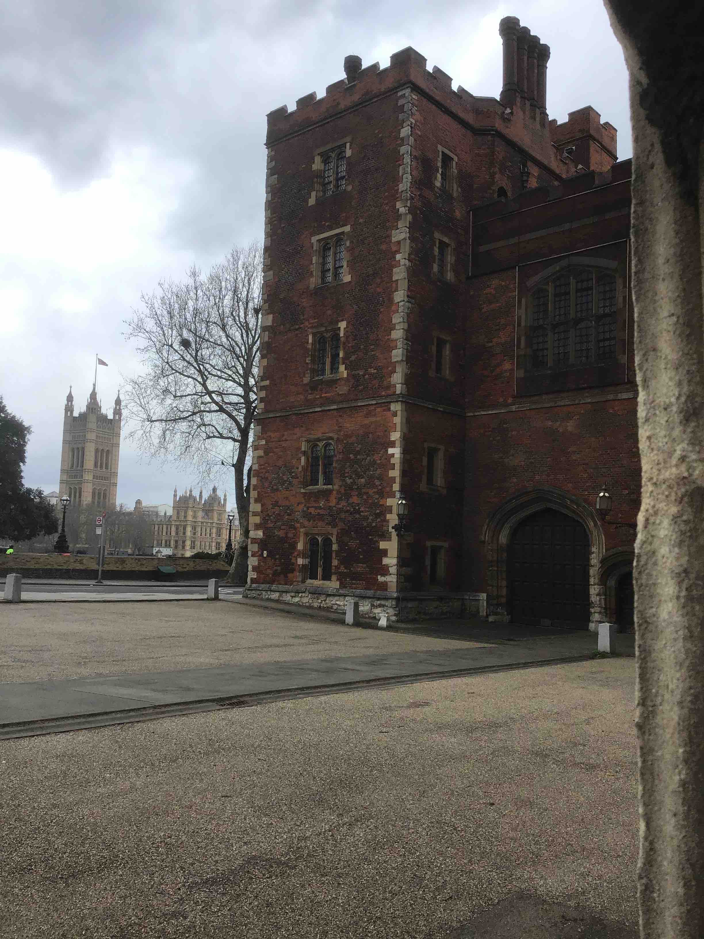 Morton's Tower, the early Tudor gatehouse to Lambeth Palace. The Palace of Westminster or Houses of Parliament can be partially observed across the river.